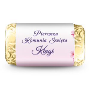 czekoladowy bądź biały michałek w złotej owijce wraz z etykietą w kolorze różowym, odpowiedni na prezent dla gości komunijnych dla dziewczynki